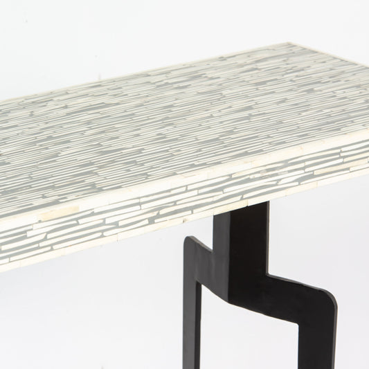 Table with a mosaic pattern on the surface and black legs